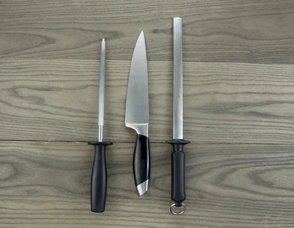 Large Kitchen Knife and Sharpeners on aged White Oak Wood