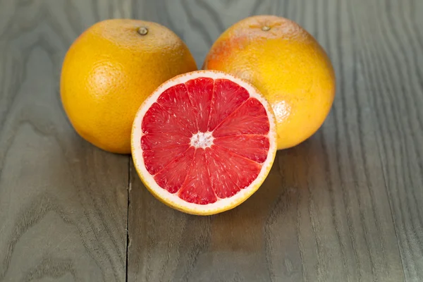 Sliced and Whole Ruby Red Grapefruits