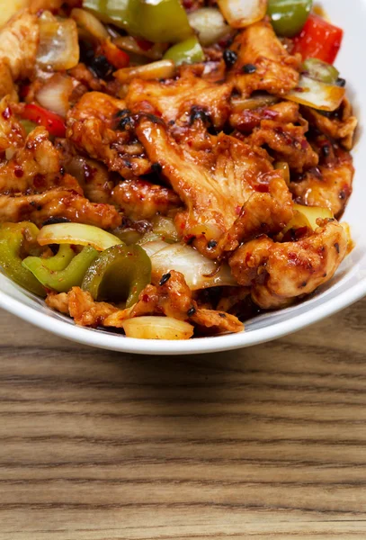 Chinese Spicy Chicken Dish in white bowl