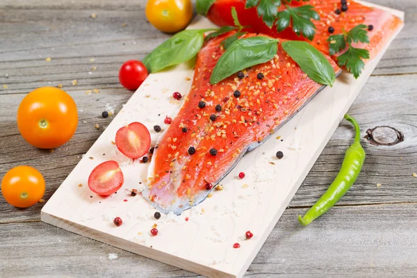 Fresh Salmon and ingredients on Wooden Cooking Plank