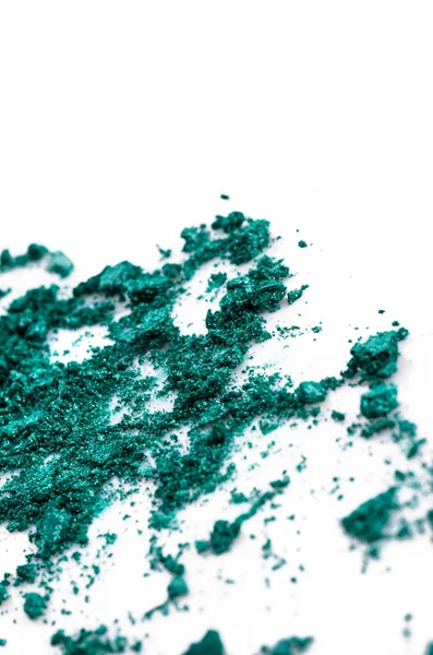 被击碎的白色背景上的绿色眼影 - 图库照片Nik
