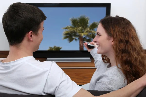 Young couple watching tv