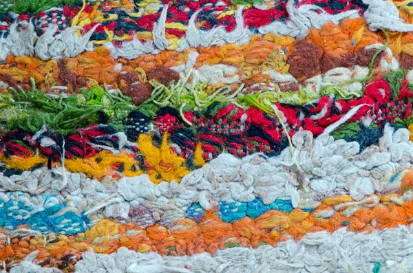 Colorful grunge dirty carpet wool thread closeup