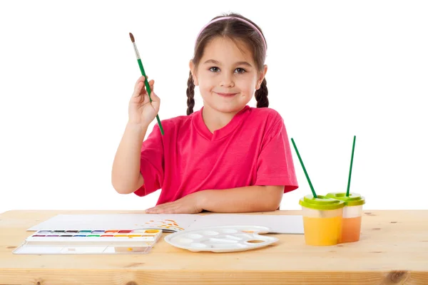 Inspired little girl with paintbrush