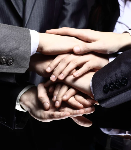 Team work concept. Business people joining hands