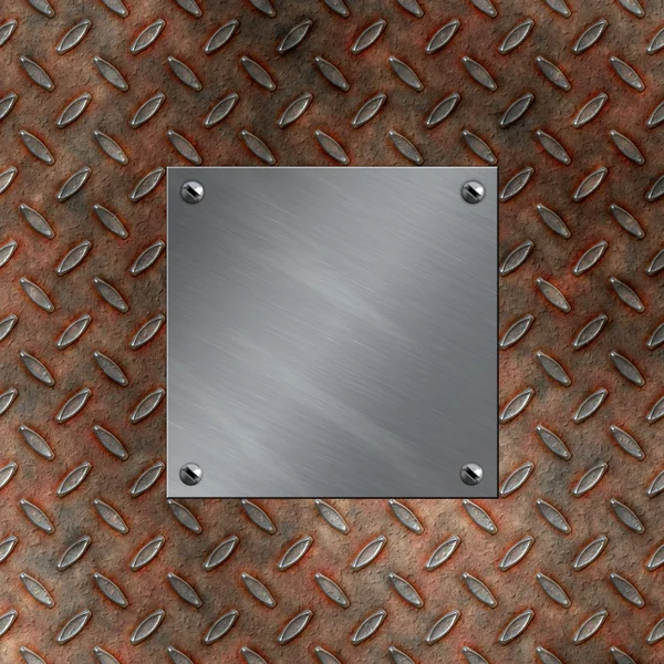 Brushed aluminum plate bolted to a grudge and rusted diamond metal background