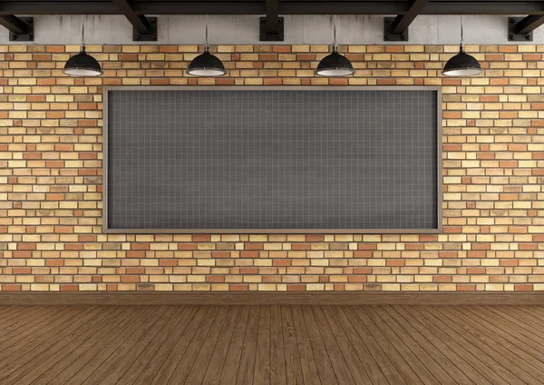 Empty loft with large blackboard squared