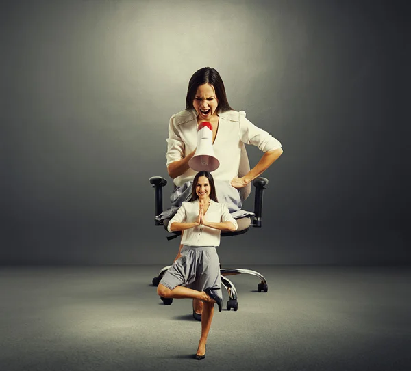 Woman sitting on the office chair and screaming