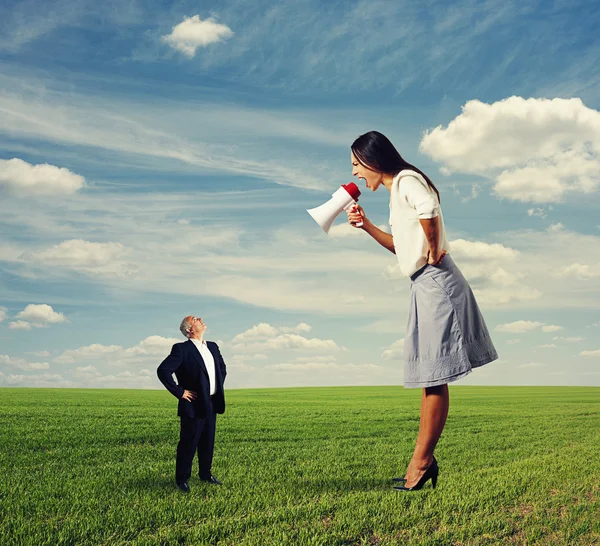 Screaming woman and calm senior man