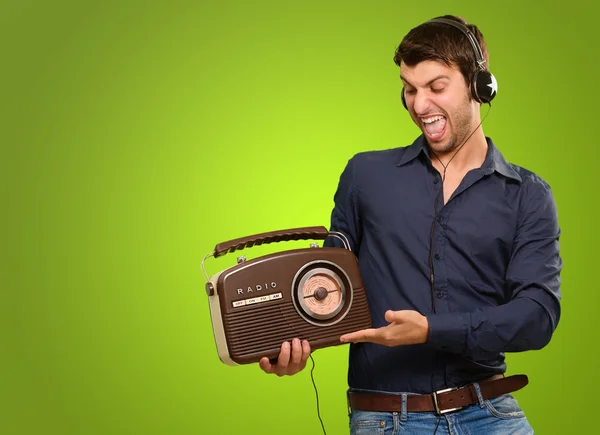 Young Man Listening To Vintage Radio