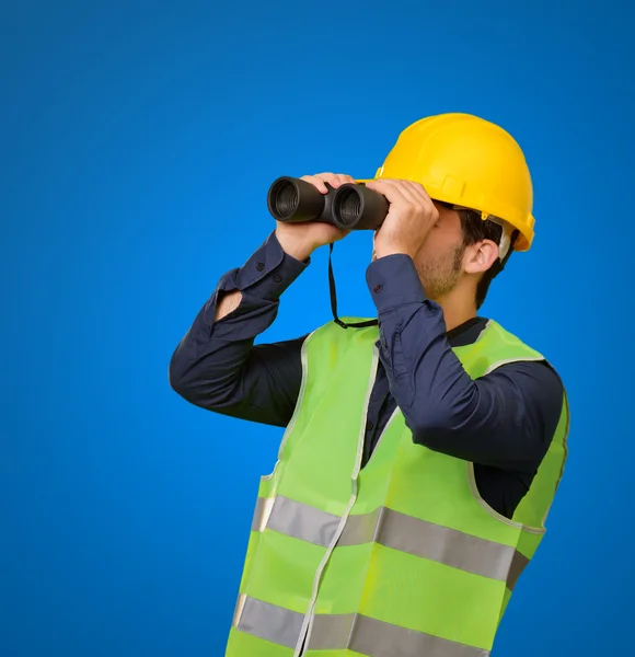 Young Engineer Looking Through Binoculars