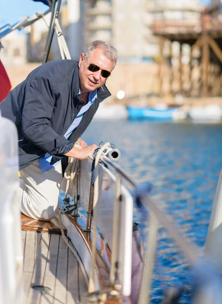 Portrait Of Mature Man On Sailboat