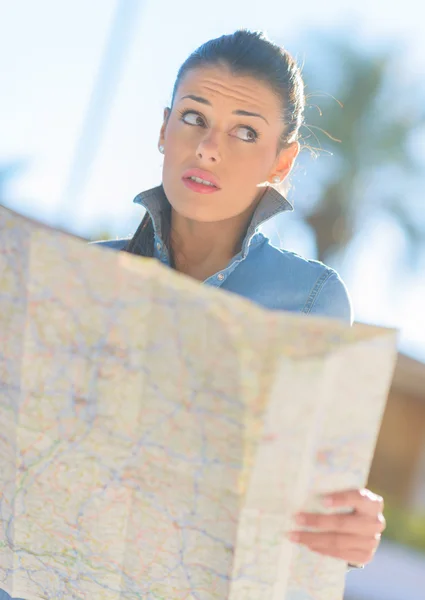 Scared Woman Holding Map