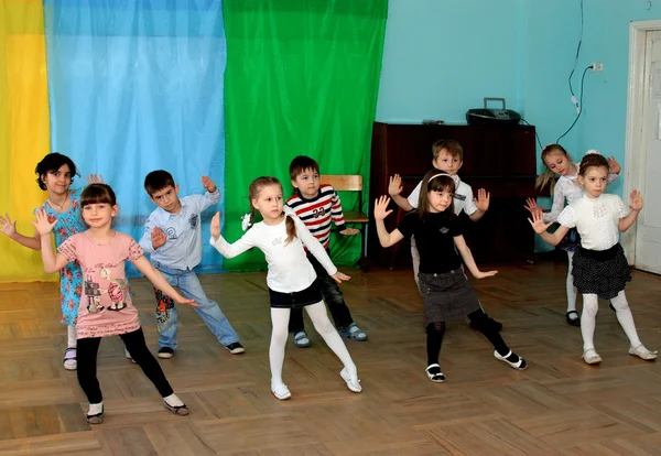 Children dance at school in a dance hall