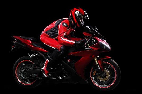Motorcyclist in red equipment