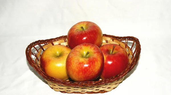 Basket of apples on white background