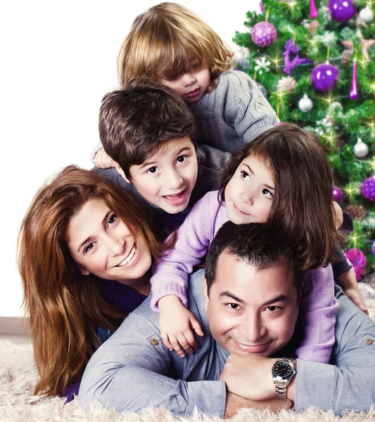 Happy family near Christmas tree