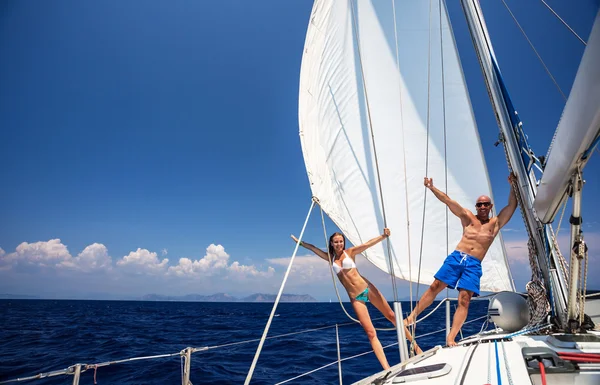 Happy couple on sailboat