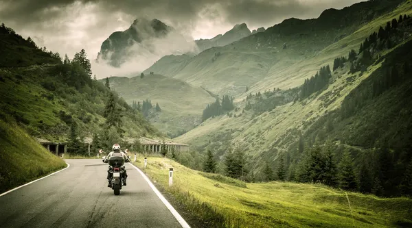 Motorcyclist on mountainous highway