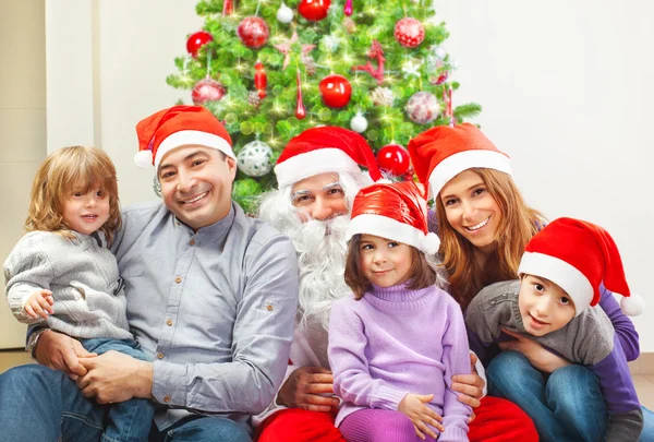 Large family near Christmas tree