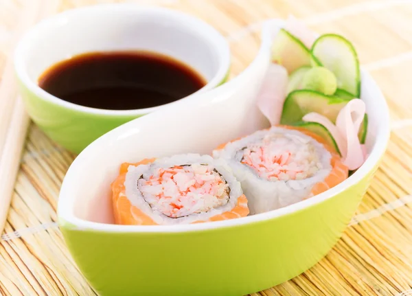 Tasty sushi with soy sauce