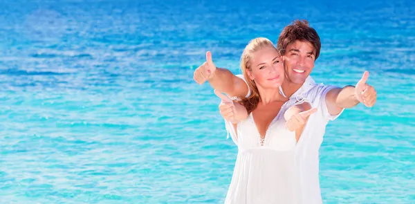 Cheerful couple enjoying beach vacation