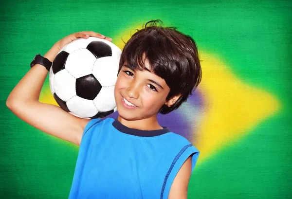 Cute boy playing football