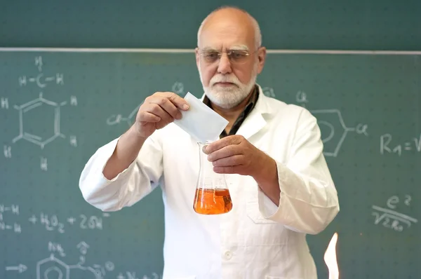 Professor mixes chemicals