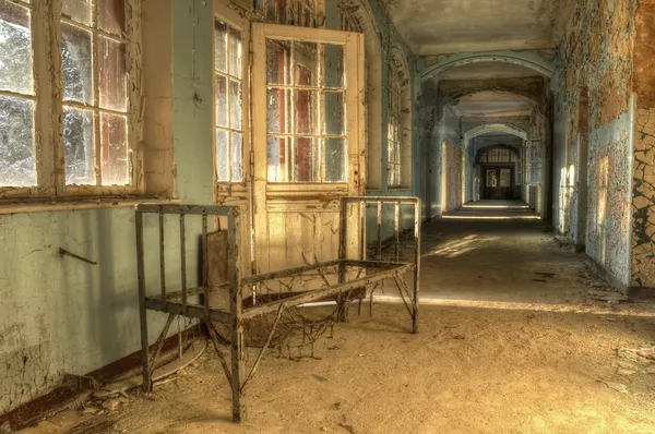 Old bed in an abandoned hospital