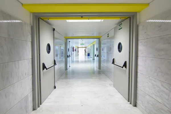 Clean and long corridor whith fire doors