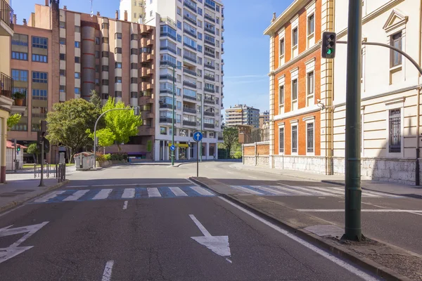 Modern street with pedestrian crossing, traffic lights and paint