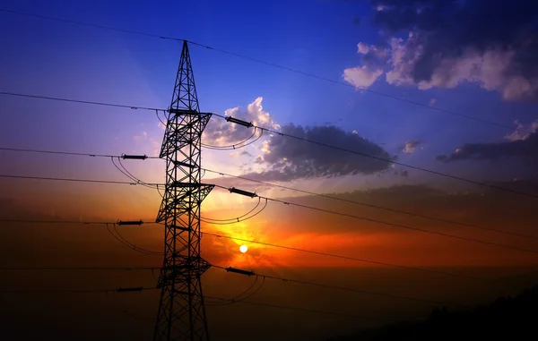 Dramatic clouds sky and electric tower