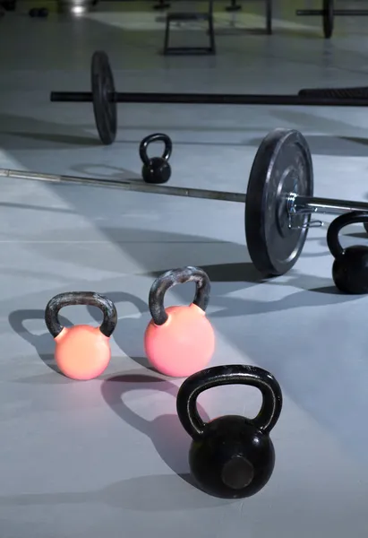 Kettlebells at crossfit gym with lifting bars