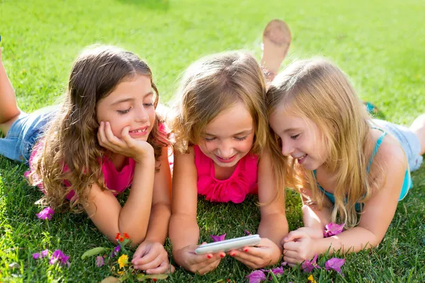 Children friend girls playing internet with smartphone
