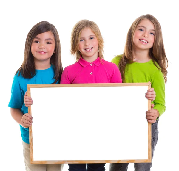 Children girls group holding blank white board copy space