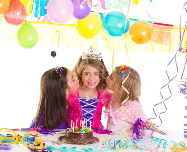 Children girls group in birthday party greetings with a kiss