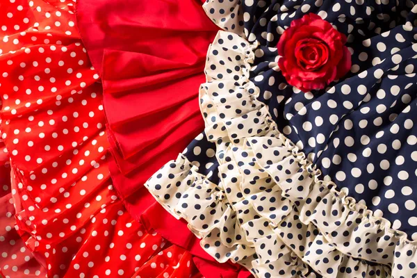 Flamenco dresses in red blue with spot and red rose