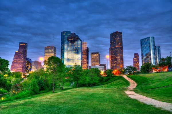 Houston Texas modern skyline at sunset twilight from park