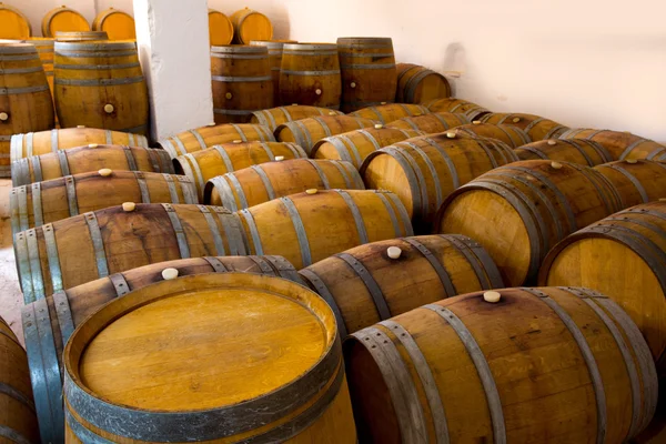 Wine wooden oak barrels in winery