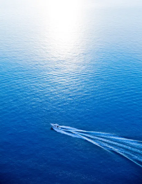 Boat cruising blue Mediterranean sea aerial view