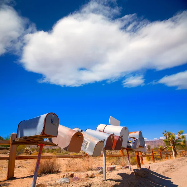 Grunge mail boxes in a row at California Mohave desert