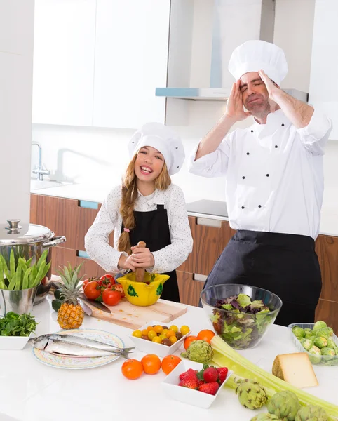 Funny chef master and junior kid girl at cooking school crazy
