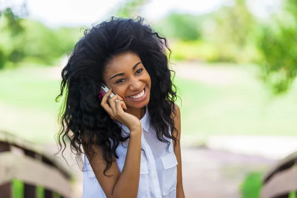 Teenage black girl using a mobile phone - African people