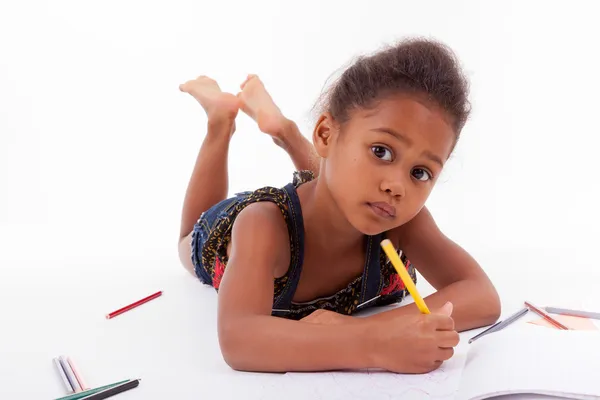 Little African Asian girl  drawing