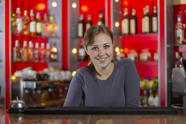 Bartender girl behind the counter