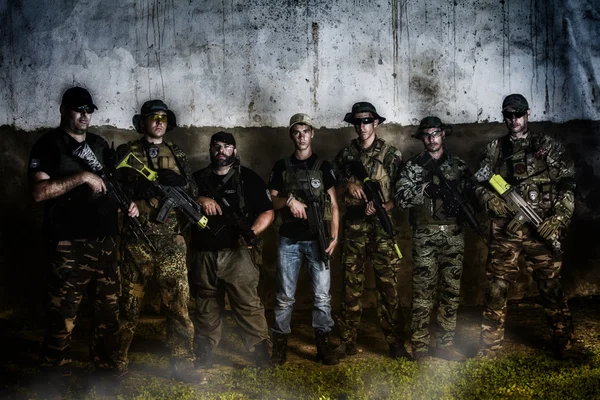 Large Airsoft group team posing in action