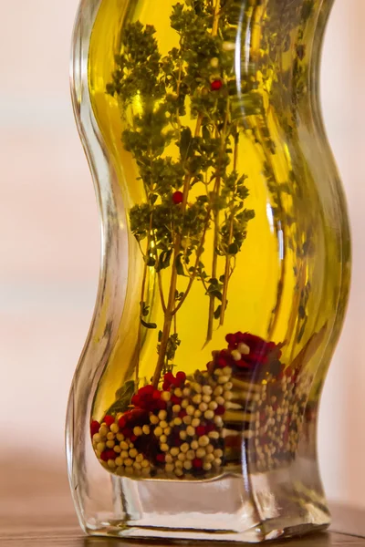 Olive oil bottle with spice herbs