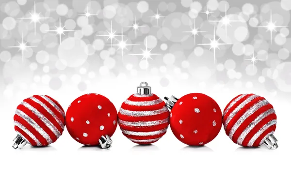 Christmas decoration balls on a star background with space for text