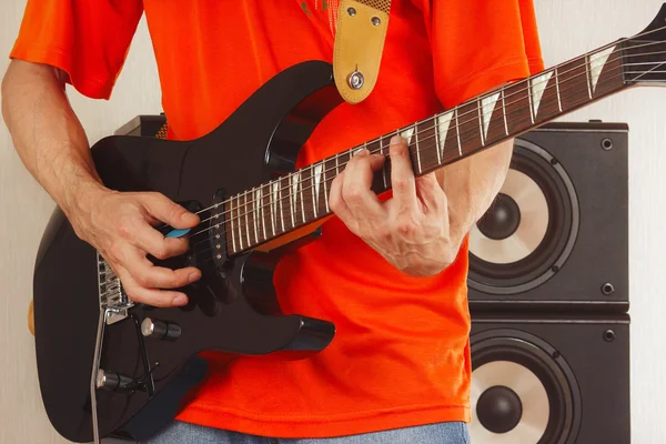 Posing hands of rock musician playing the guitar