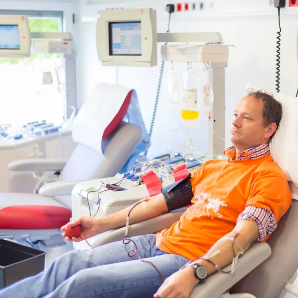 Blood donor at donation.